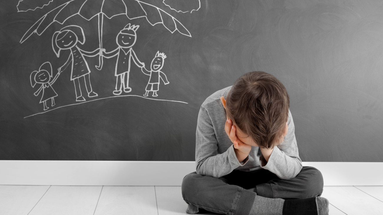 child whose depression is sitting on the floor